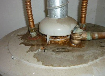 hot water heater leaking from top anode|Water Heater Leaking From the Top Fixes 